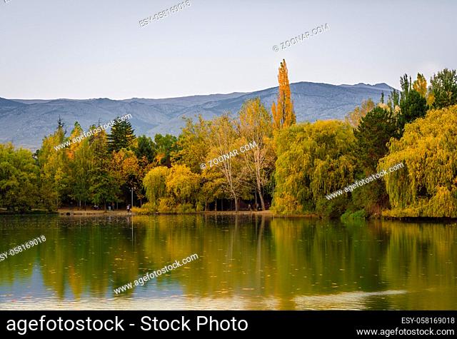 Autumn colors and reflection on Puigcerda's pond in Pyrenees. Located in north Catalonia, Spain
