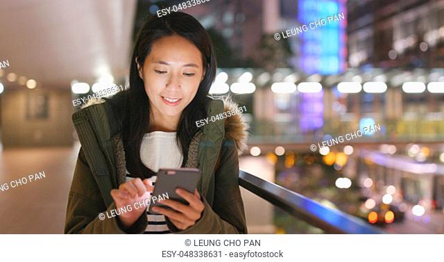 Asian Woman use of cellphone in Hong Kong