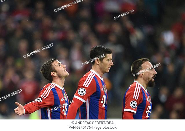 Munich's Mario Goetze (l-r), Robert Lewandowski and Franck Ribery celebrate his 2-0 goal during the Champions League group E match between FC Bayern Munich and...
