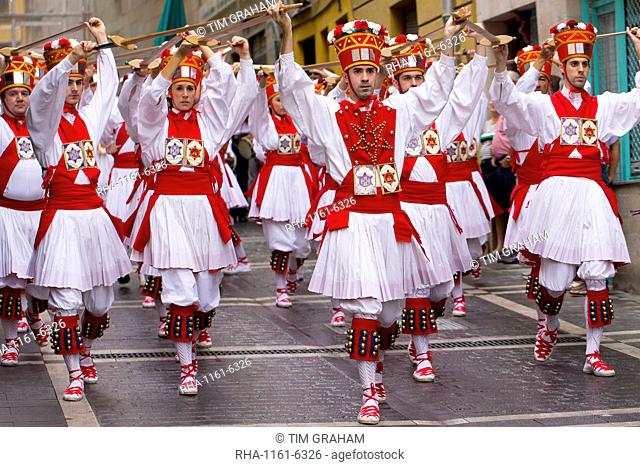 Dancers in procession through the streets during San Fermin Fiesta at Pamplona, Navarre, Northern Spain