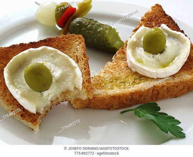 Toast with olive oil and goat cheese with salted fish