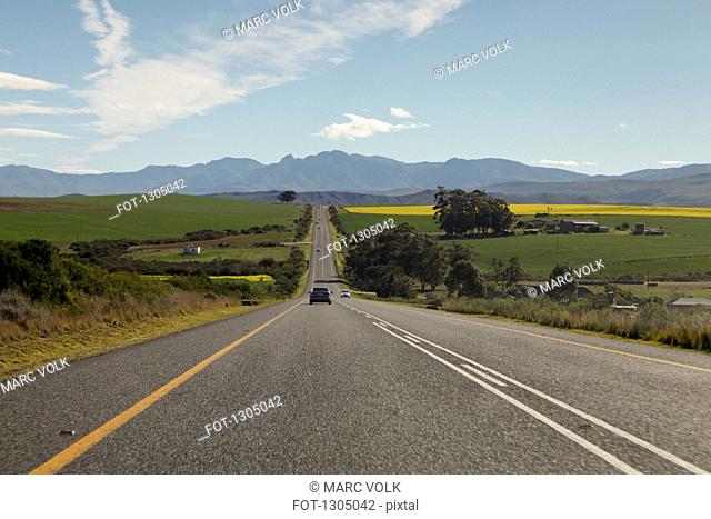 Cars on a road leading to the Riviersonderend Mountains, South Africa