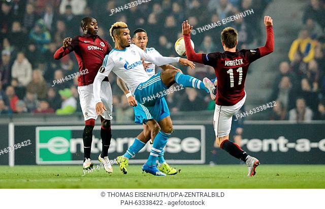 Eric Maxim Choupo-Moting (C) of Schalke and Lukas Marecek (r) and Kehinde Fatai of Prague vie for the ball during the Europa League Group K soccer match between...
