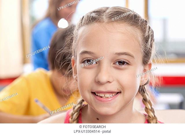 Girl looking at camera and smiling