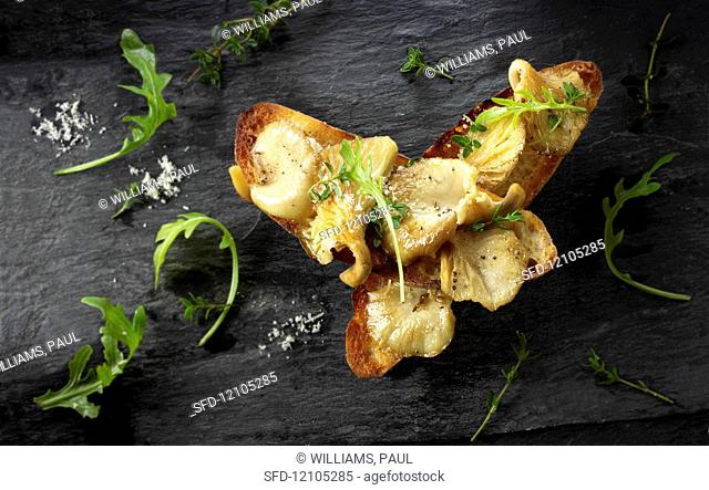 Yellow Oyster mushrooms sauteed in butter and served on sour dough toast with wild rocket