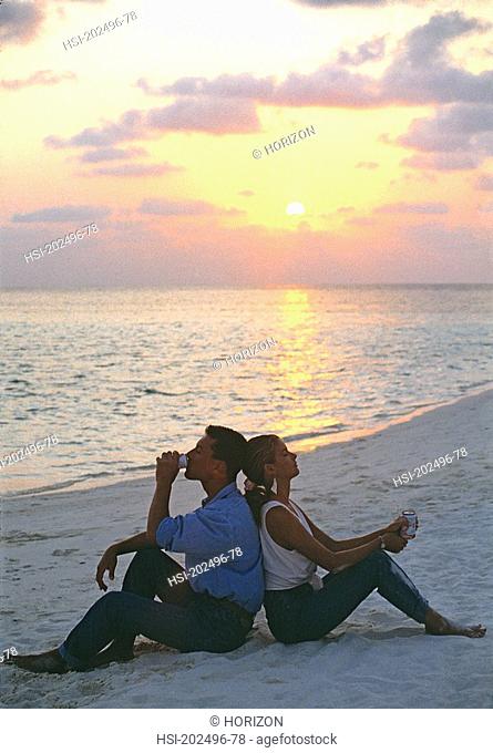 Lifestyle, Young couple in swimwear, Beach, Sunset, Travel, Maldives