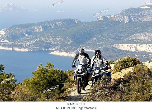 2 motorcycles, single cylinder Enduros, Yamaha Tenere and BMW G 650 GS, moving, Southern France, Mediterranean Sea, ocean view