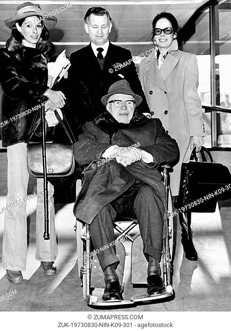 Aug. 30, 1973 - London, England, U.K. - British actor CHARLIE CHAPLIN (in wheelchair) with his wife OONA (right) and daughter GERALDINE (left) on the Heathrow...