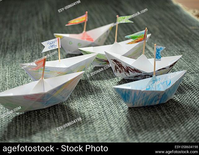 Paper ships made and painted by children