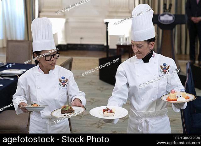 White House Executive Chef Cris Comerford and White House Executive Pastry Chef Susie Morrison display food samples to be served Thursday evening’s State Dinner...