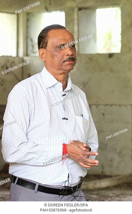 T. R. Chouhan stands in an old factory buildings of the Union Carbide Factory, where once he worked as plant director in Bhopal, India, 28 October 2014