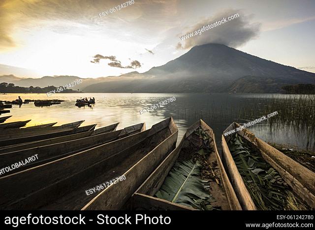 Canoes beached on Lake Atitlan in front of Volcan San Pedro, Santiago Atitlan, Sololá Department, Guatemala, Central America