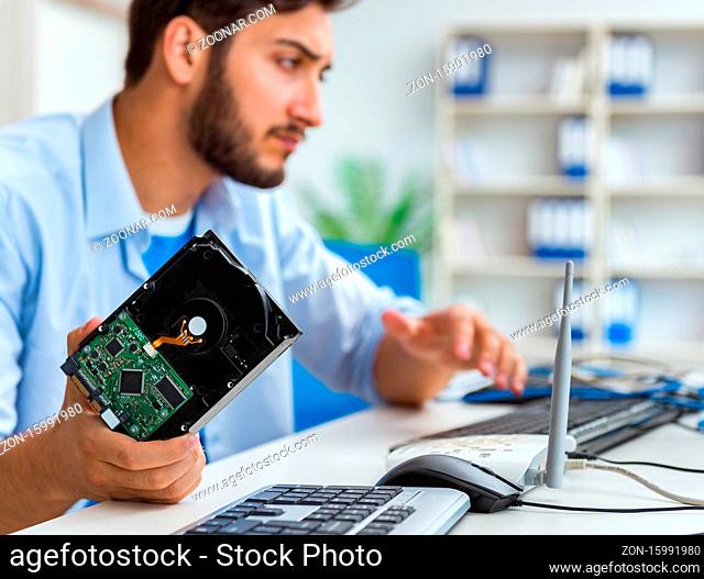 The technician with broken hard drive