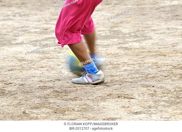 Girl playing soccer, detailed view of the feet with the ball, indigenous community of La Curvita, called Hothaj in the language of the Wichi Indians
