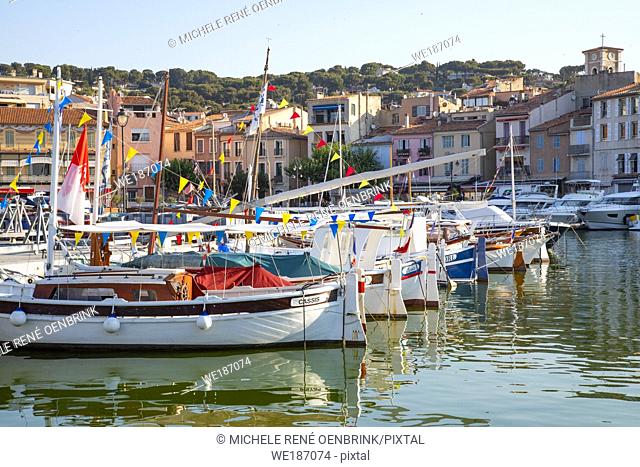Classic sailboats in the harbour of the Mediterranean fishing port of Cassis, France,