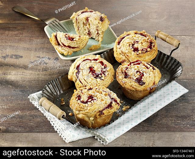 Croissant muffins with blackberry jam and almonds