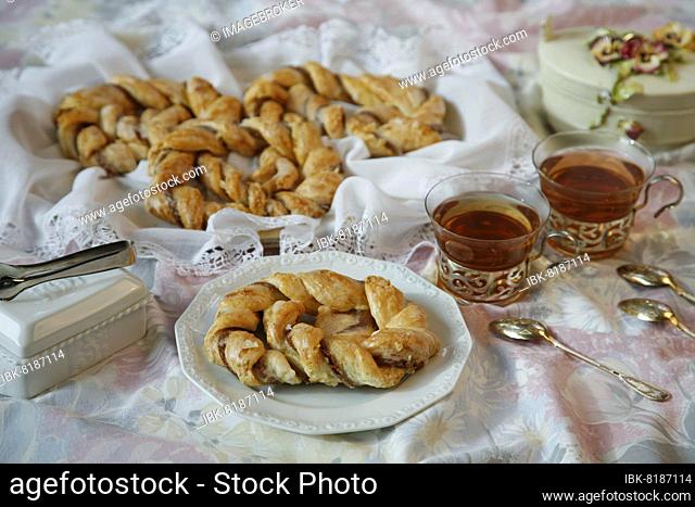 Swabian cuisine, Swabian biscuits, Olgabrezel, sweet puff pastry pretzel, tea biscuits, long-life biscuits, silver tea spoons, tea glasses, black tea