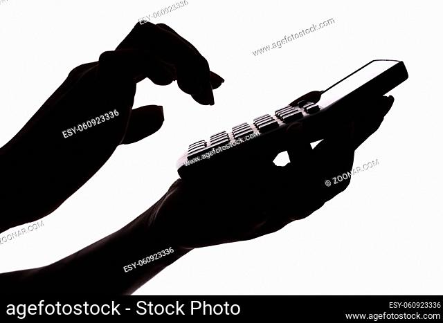 isolated on white silhouette of woman's hands with calculator