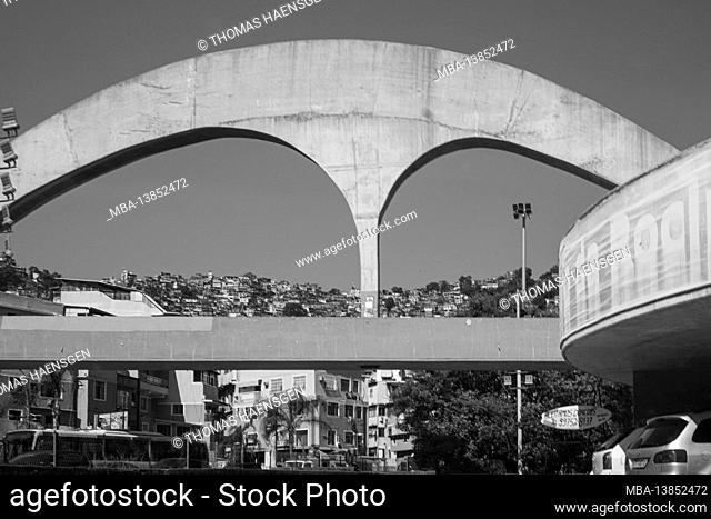 The reinforced concrete pedestrian bridge to the Rocinha favela in the background was designed by Brazilian architect Oscar Niemeyer