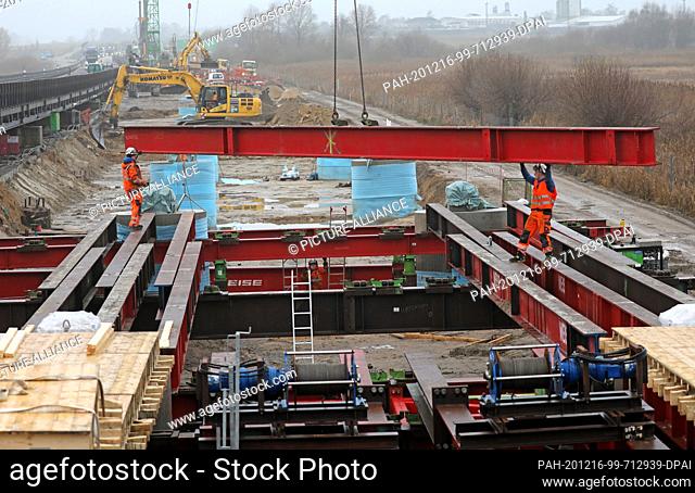 16 December 2020, Mecklenburg-Western Pomerania, Tribsees: Work on the new bridge on the subsided A 20 Baltic motorway is in full swing