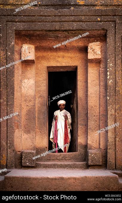 coptic orthodox priest at lalibela ancient rock-hewn monolithic churches landmark UNESCO heritage site in ethiopia