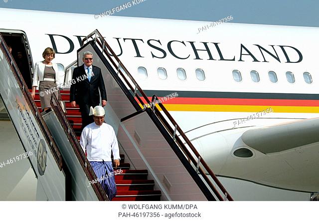 German President Joachim Gauck and his partner Daniela Schadt leave the government plane in Naypyidaw, Myanmar, 10 February 2014