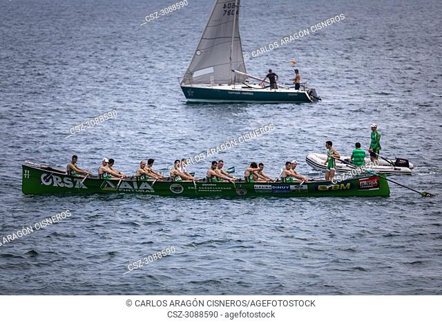 CASTRO URDIALES, SPAIN - JULY 15, 2018: Competition of boats, regata of trainera, Go Fit Hondarribia boat greets the public in the VI Bandera CaixaBank...