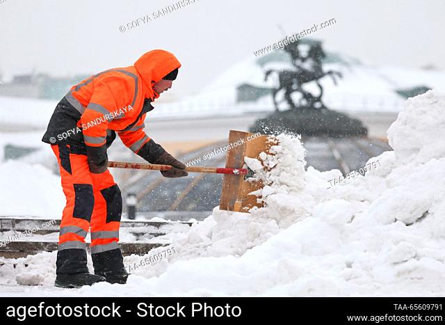 RUSSIA, MOSCOW - DECEMBER 10, 2023: Street cleaners shovel snow in Manezhnaya Square. Sofya Sandurskaya/TASS