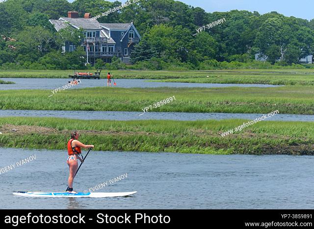 People paddleboarding in Swan pond river in Dennis port, Cape Cod