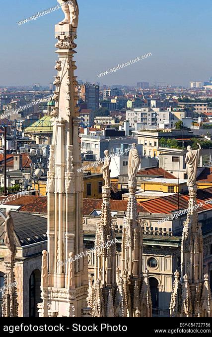 MILAN, ITALY - SEPTEMBER 28, 2018: Milan Cathedral (Duomo di Milano), gothic church, top view of the city. It is the largest church in Italy and the third...