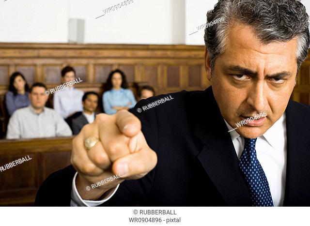 Portrait of a male lawyer pointing