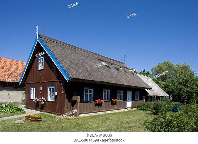 Lithuania - Klaipéda County - Curonian Spit (UNESCO World Heritage List, 2000) - Nida. A typical thatched house