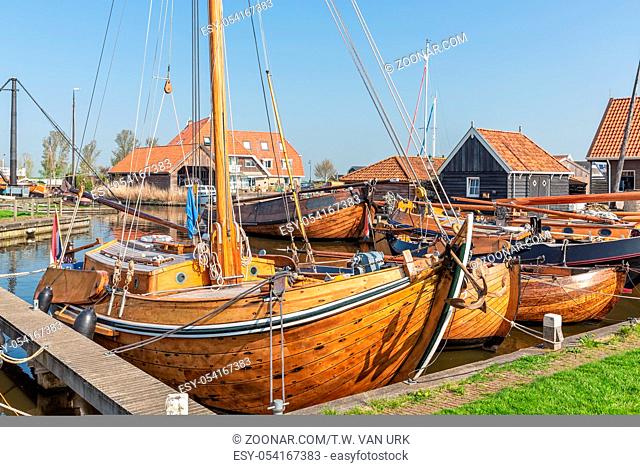 Historical ships and fishing vessels anchored in harbor Dutch fishing village Workum