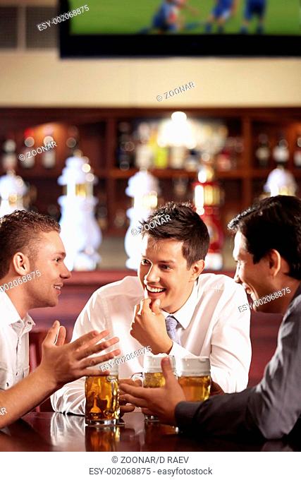 Men speak out for a beer at the bar