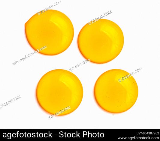 Honey drops. Honey for design elements. Abstract pattern from honey drops. Isolated on white with clipping path. Can use for design or text