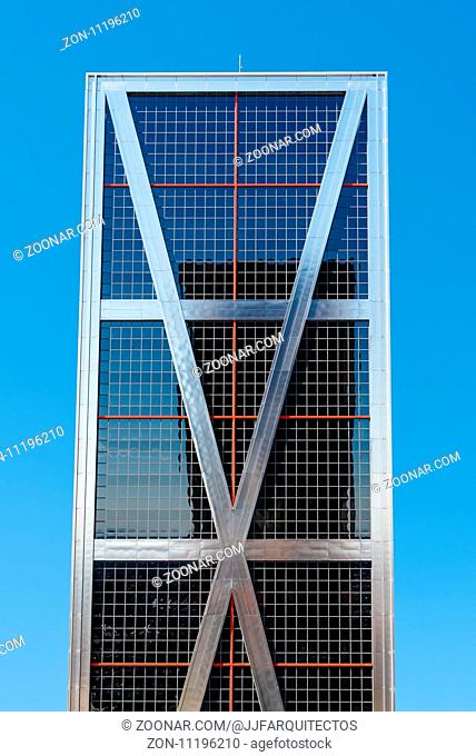 Madrid, Spain - March 20, 2017: Low angle view of The Gate of Europe towers against blue sky. They are twin office buildings designed by architect Philip