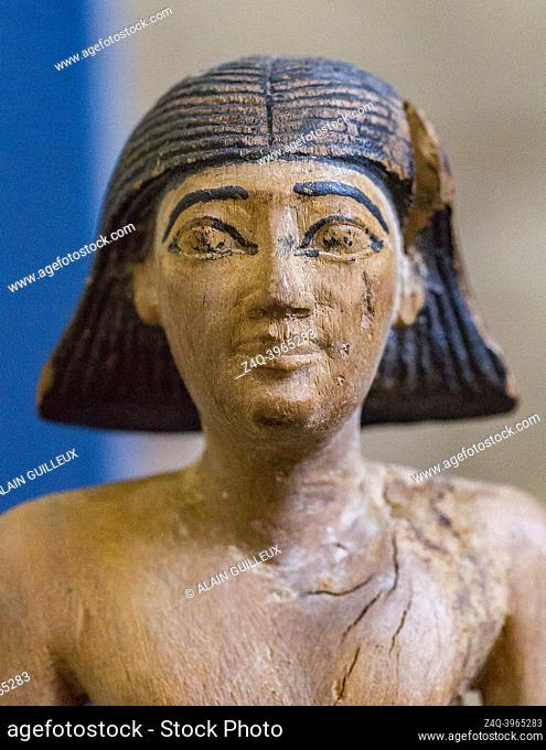 Cairo, Egyptian Museum, statuette of Iby, in wood. He's shown as a young boy, naked, with a wig