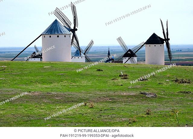 23 September 2019, Spain, Campo De Criptana: Windmills stand on a meadow at the edge of Campo de Criptana. The region served Miguel de Cervantes as the setting...
