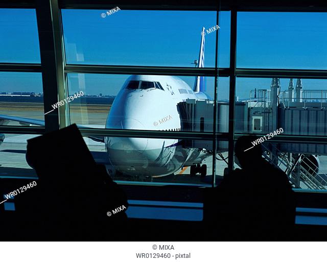 Traveler waiting to board airplane