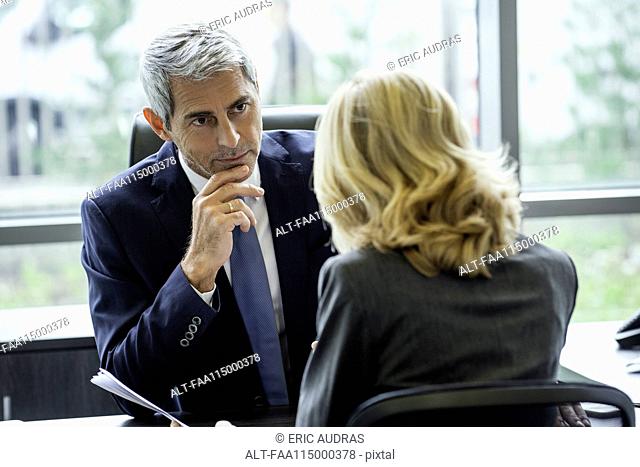 Businesspeople discussing in office