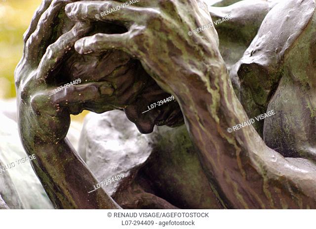 Rodin's statue of man with hands around his head. Paris. France