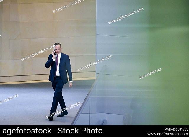 Volker Wissing (FDP), Federal Minister for Transport and Digital Affairs, makes a telephone call in the plenary session of the Bundestag