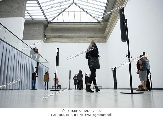 15 February 2018, Germany, Dresden: Visitors ..stroll through the exhibition 'Susan Philipsz. Separated Strings' by British artist Susan Philipsz at the...