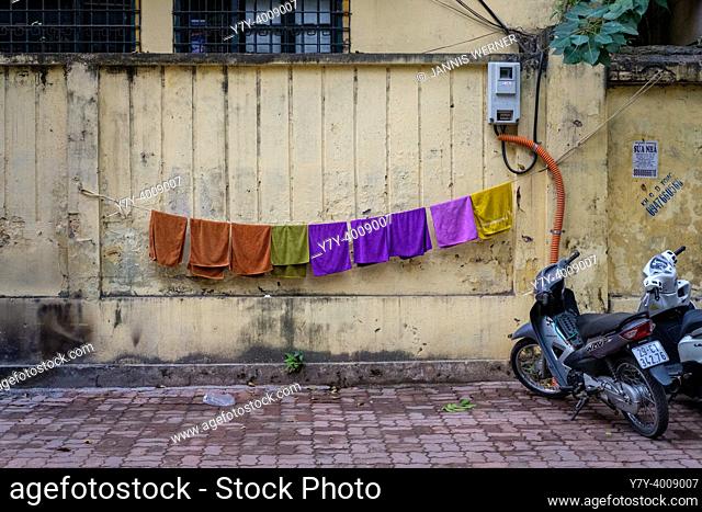 HANOI, VIETNAM - JANUARY 5, 2020: Laundry hanging to dry in the streets of Hanoi, Vietnam on January 5, 2020