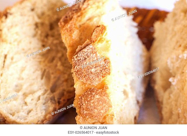 Rustic Bread slices on basket. Macro shot with sunlight