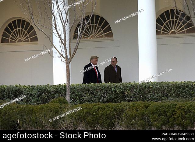 United States President Donald J. Trump speaks to Acting White House Chief of Staff Mick Mulvaney at the White House in Washington D.C., U.S