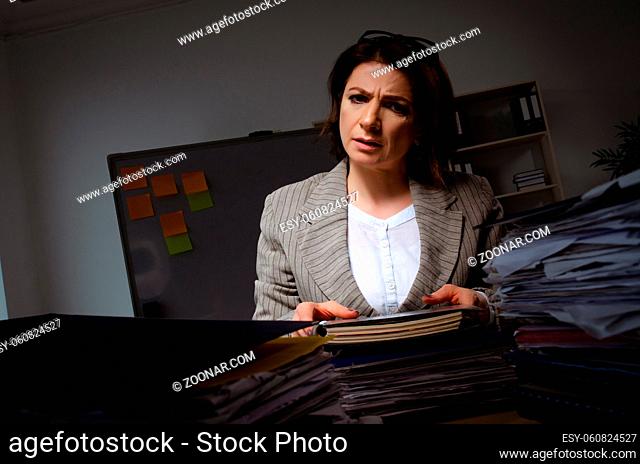 Female employee suffering from excessive work
