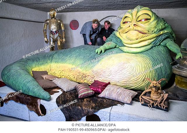 25 April 2019, Mecklenburg-Western Pomerania, Dassow: The Star Wars fans and founders of the ""Outpost One"" fan project, Kirstin and Marc Langrock