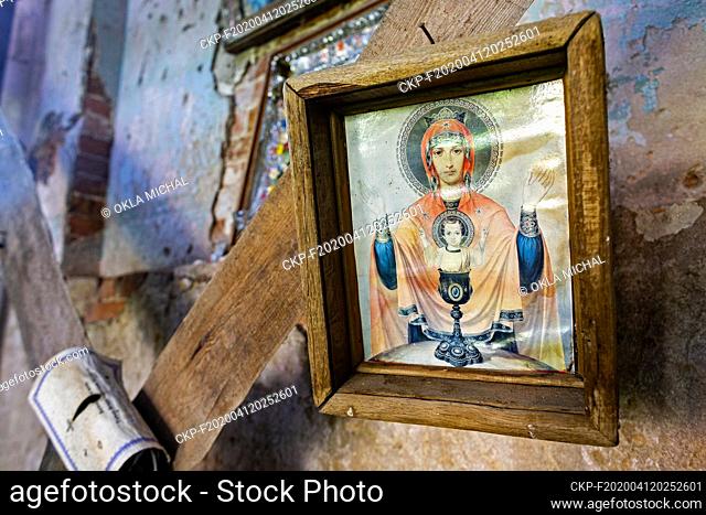 The June 18, 2019, photo of a Holy Card in ruined church in abandoned territory in Ukraine nearby Chernobyl Nuclear Power Plant