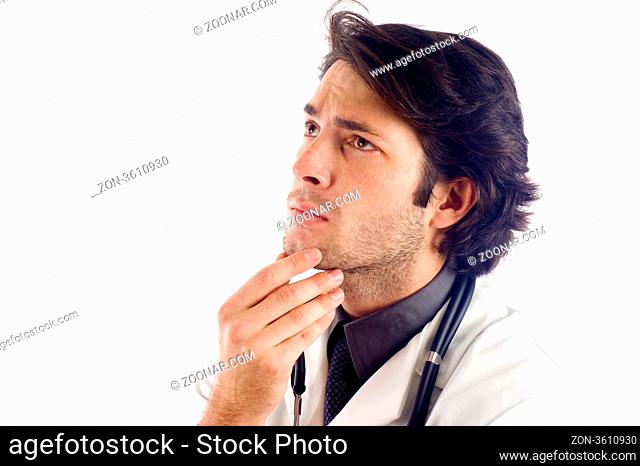 Pensive Medical Doctor, a lot of Copyspace - Isolated over a white background Pensive Medical Doctor, a lot of Copyspace - Isolated over a white background